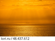 Beatiful sunset above the mediterranean sea. Sunrise with red and orange skies and the sun shining. Стоковое фото, фотограф Сергей Богомяко / Фотобанк Лори