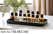 fragrance bottle essential oil ai generated. Стоковое AI-изображение, AI-художник Vectorwin / Фотобанк Лори