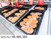 Steaks of fresh salmon fish on the counter. Raw red fish for sale. Seafood shop. Стоковое фото, фотограф FotograFF / Фотобанк Лори