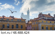 Basilique Notre-Dame de la Garde in the foggy background with red tiled roof Marseille houses (2018 год). Стоковое фото, фотограф Сергей Богомяко / Фотобанк Лори