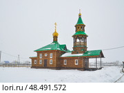 Церковь святого апостола Андрея Первозваного зимой во время снегопада. Село Вагай. Омутинский район. Тюменская область (2018 год). Стоковое фото, фотограф Александр Тараканов / Фотобанк Лори