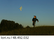 A little boy is playing outside with a toy airplane that he made himself. childhood. Стоковое фото, фотограф Есич Елена / Фотобанк Лори