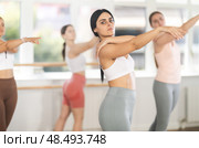 Young ballerinas rehearse ballet poses during ballet classes. Стоковое фото, фотограф Яков Филимонов / Фотобанк Лори