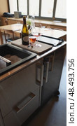 Russia, St.Petersburg, 24 April 2025: bottle of champagne is cooled in a niche with ice in the restaurant, local lighting, wine cabinet, decanters for sparkling wine. Редакционное видео, видеограф Vladimir Drozdin / Фотобанк Лори
