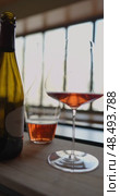 Russia, St.Petersburg, 24 April 2025: bottle of champagne is cooled in a niche with ice in the restaurant, local lighting, wine cabinet, decanters for sparkling wine. Редакционное видео, видеограф Vladimir Drozdin / Фотобанк Лори