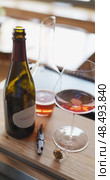Russia, St.Petersburg, 24 April 2025: bottle of champagne is cooled in a niche with ice in the restaurant, local lighting, wine cabinet, decanters for sparkling wine. Редакционное видео, видеограф Vladimir Drozdin / Фотобанк Лори