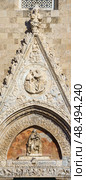 MESSINA, ITALY - NOVEMBER 06, 2018 - Elements of decoration of the doors of the Bell Tower of the Cathedral of Messina, Sicily. Стоковое фото, фотограф Сергей Богомяко / Фотобанк Лори