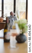 Russia, St.Petersburg, 24 April 2025: bottle of champagne is on table, flowers, wine glass in the restaurant, local lighting, wine cabinet, decanters for sparkling wine. Редакционное видео, видеограф Vladimir Drozdin / Фотобанк Лори