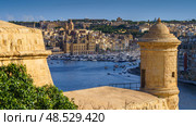 VALLETTA, MALTA - NOVEMBER 12, 2018 - Panoramic view of the Grand Harbor Tricity bay, Birgu and Senglea islands with ships and boats in the port. Стоковое фото, фотограф Сергей Богомяко / Фотобанк Лори