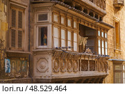 Typical Maltese covered balconies in Valetta, Malta (2018 год). Стоковое фото, фотограф Сергей Богомяко / Фотобанк Лори
