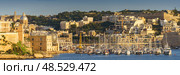 VALLETTA, MALTA - NOVEMBER 12, 2018 - Panoramic view of the Grand Harbor Tricity bay, Birgu and Senglea islands with ships and boats in the port. Стоковое фото, фотограф Сергей Богомяко / Фотобанк Лори