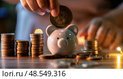 A person is inserting a coin into a traditional piggy bank in this close-up shot. Стоковое AI-изображение, AI-художник Данила Большаков / Фотобанк Лори