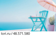 Summer Terrace Bliss: Turquoise Chair with Refreshments Under a Pastel Sunshade, Vacation Retreat. Стоковое AI-изображение, AI-художник Данила Большаков / Фотобанк Лори