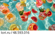 A pool filled with a variety of different drinks, creating a colorful and enticing display for guests to enjoy. Стоковое AI-изображение, AI-художник Данила Большаков / Фотобанк Лори