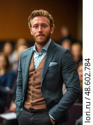 The man, elegantly attired in a suit with a waistcoat, stands poised in a conference hall filled with an engaged audience. Стоковое AI-изображение, AI-художник Данила Большаков / Фотобанк Лори