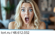 A blonde woman gasps in disbelief, her eyes wide open while staring at a laptop in a bright, inviting living room setting. Стоковое AI-изображение, AI-художник Данила Большаков / Фотобанк Лори