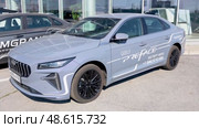 Geely Preface vehicle next the showroom of official dealer. Chinese automobile manufacturer. Редакционное видео, видеограф FotograFF / Фотобанк Лори