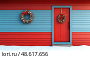 A vibrant wooden house features red and blue siding, adorned with festive wreaths on its door and wall, surrounded by fresh snow in winter. Стоковое AI-изображение, AI-художник Данила Большаков / Фотобанк Лори