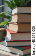 Stacked books with colorful covers on a wooden table indoors. Стоковое AI-видео, аниматор KATERINA AI / Фотобанк Лори