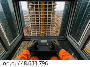 Фотореалистичное изображение с видом от первого лица, снятое из кабины башенного крана на высоте. Стоковое AI-изображение, AI-художник Sergey Starostin / Фотобанк Лори