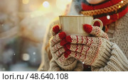 Gloved hands gently cradling a steaming cup of aromatic coffee outdoors. Warm cozy winter scene. Hot Mug of beverage in the wool mittens closeup. Warming drink at cold weather. Hike, camping concept. Стоковое AI-видео, аниматор Марина Демидюк / Фотобанк Лори