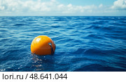 Buoyant orange buoy floats on calm blue ocean waters under a sunny sky. Стоковое AI-изображение, AI-художник Александр Довянский / Фотобанк Лори
