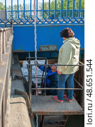 Kronstadt, Russia. June 11, 2015. Surveyors measure sea level. From the zero point of the Kronstadt footpost, measurements of the depth of the Baltic Sea and absolute heights are made throughout Russia. Редакционное фото, фотограф Оксана Медведева / Фотобанк Лори