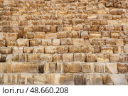 Exploring the ancient stone steps of the Great Pyramid in Egypt during midday. Стоковое фото, фотограф Сергей Толмачёв / Фотобанк Лори