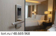 Woman guest entering hotel room using electronic keypad. Стоковое AI-видео, аниматор Юрий Поздников / Фотобанк Лори