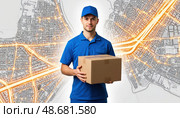 A man in a blue shirt is holding a cardboard box. Стоковое AI-изображение, AI-художник Ярославский Максим / Фотобанк Лори
