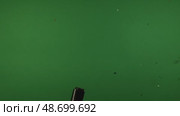 Man explodes a firecracker with shiny confetti footageschromakey, green screen. Стоковое видео, видеограф Ольга Коваленко / Фотобанк Лори