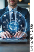 A person in a business suit working on a laptop with virtual icons related to data analysis, showcasing charts, graphs, diagrams, market trends and other finance symbols. Стоковое AI-видео, аниматор Sergey Grishin / Фотобанк Лори