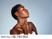 Elegant woman poses for beauty portrait with flawless skin, showcasing graceful expression in studio setting. Стоковое фото, фотограф Сергей Толмачёв / Фотобанк Лори