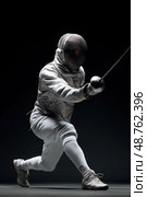 A man in a white outfit is fencing with a sword. Стоковое AI-изображение, AI-художник Ярославский Максим / Фотобанк Лори