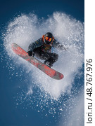 A snowboarder is in mid-air, performing a trick. Стоковое AI-изображение, AI-художник Ярославский Максим / Фотобанк Лори