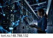 Hightech data center with woman using laptop and digital glowing blue lines. Стоковое AI-изображение, AI-художник Anastasy Yarmolovich / Фотобанк Лори