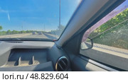 The driver controls the car while driving through the city streets. The camera is 360 degrees. Russia. Moscow 05.25.2025. Стоковое видео, видеограф Ярославский Максим / Фотобанк Лори