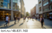 Defocused image of wide street with cars and tall glass buildings, green trees on sidewalks, sunny day in modern business zone, road stretching forward, clean environment, daytime scenery. Стоковое фото, фотограф Павел Муравьев / Фотобанк Лори