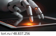 A close-up image of a robotic hand interacting with a tablet, highlighting the digital capabilities of advanced robotics. Стоковое AI-изображение, AI-художник Данила Большаков / Фотобанк Лори