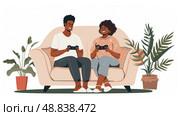 A couple sits on a couch in a living room playing video games. Both are smiling and seem to be enjoying themselves. Стоковое AI-изображение, AI-художник Данила Большаков / Фотобанк Лори