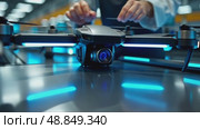 A close-up of a worker assembling a drone on a high-tech production line, with neon blue accents and sleek machinery in the background. Стоковое AI-видео, аниматор Sergey Grishin / Фотобанк Лори