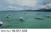 Traditional Philippines boats in sea. Стоковое видео, видеограф Михаил Коханчиков / Фотобанк Лори