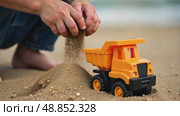Colorful children toy bucket with sand stands in sandbox. AI Generative. Стоковое AI-видео, аниматор Spirit River / Фотобанк Лори