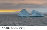 Big Iceberg in Antarctica Winter Scenery, Amazing Shape Ice Formation of Massive Large Enormous Blue Icebergs in Antarctic Peninsula Landscape Seascape with Ocean Sea Water. Стоковое видео, видеограф Vladimir / Фотобанк Лори