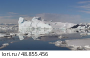 Big Iceberg in Antarctica Winter Scenery, Amazing Shape Ice Formation of Massive Large Enormous Blue Icebergs in Antarctic Peninsula Landscape Seascape with Ocean Sea Water. Стоковое видео, видеограф Vladimir / Фотобанк Лори