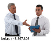 Angry boss displaying his displeasure to his employee. Стоковое фото, агентство Ingram Publishing / Фотобанк Лори