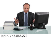 businessman working at his desk. Стоковое фото, агентство Ingram Publishing / Фотобанк Лори