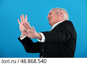 An horrified mature businessman. Стоковое фото, агентство Ingram Publishing / Фотобанк Лори