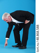 Mature businessman pointing. Стоковое фото, агентство Ingram Publishing / Фотобанк Лори