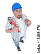 Plumber grimacing. Стоковое фото, агентство Ingram Publishing / Фотобанк Лори